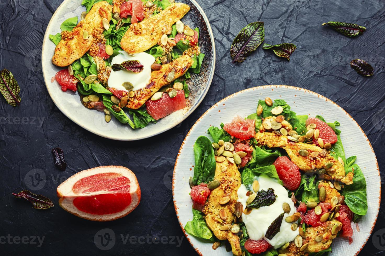 Healthy salad of chicken meat and grapefruit photo