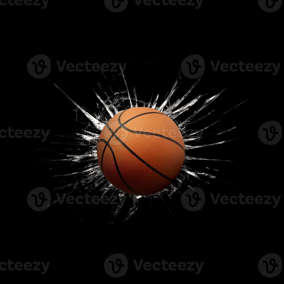 Fast basketball through broken glass on black background photo