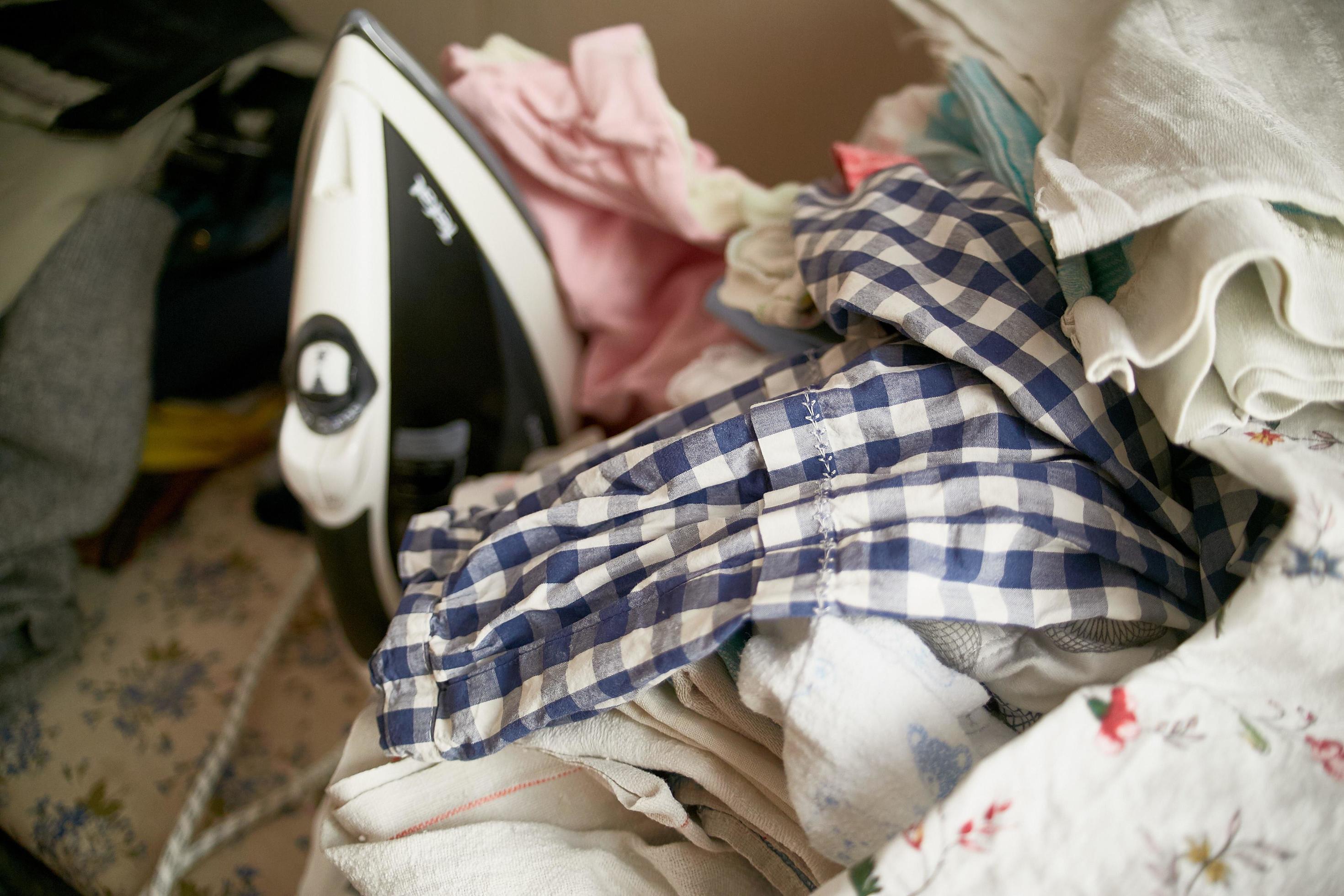 Iron on an ironing board. Ironing board. The laundry is washed. Linen