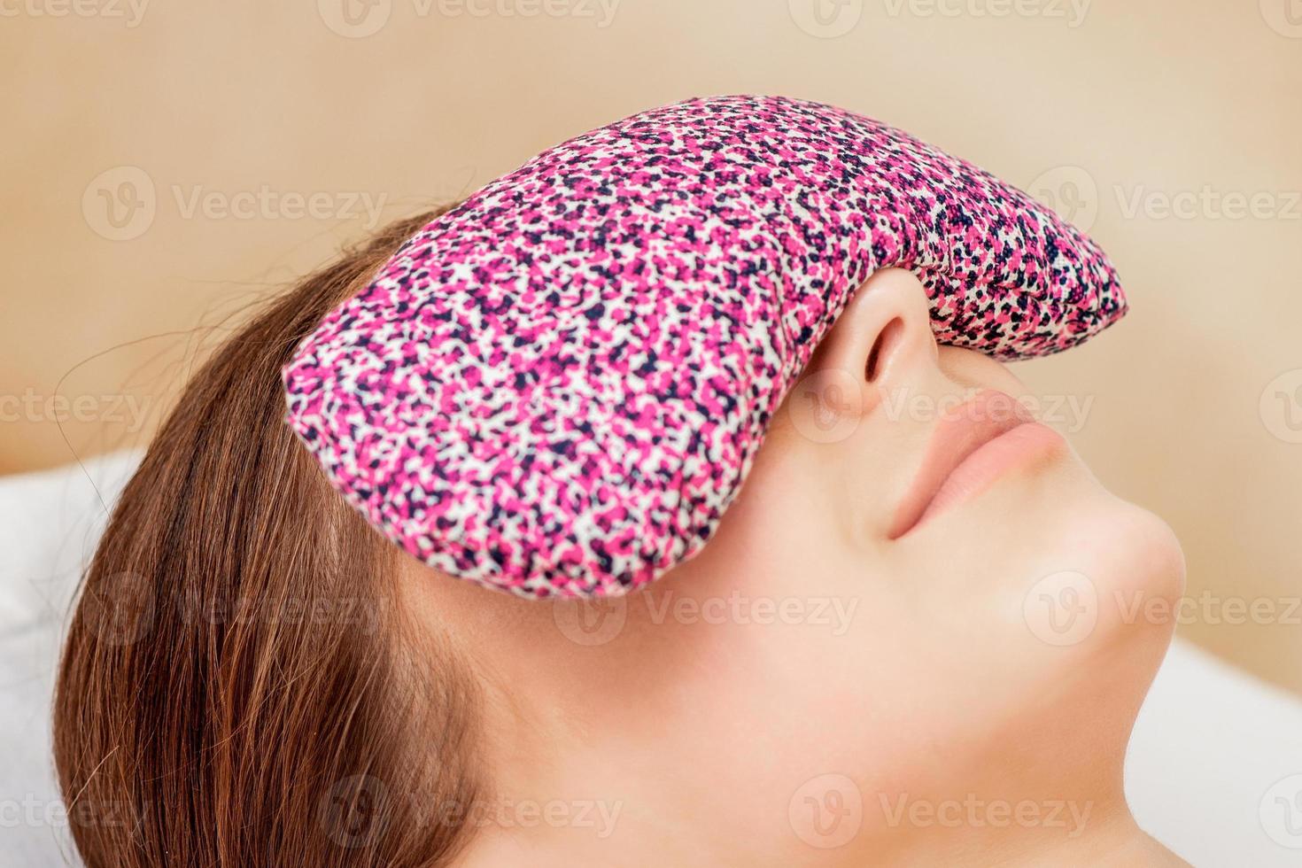 Restorative eye pillow covers eyes. photo