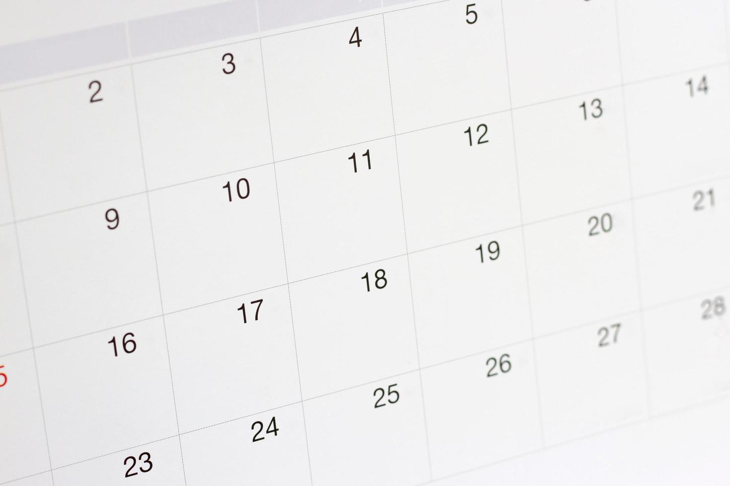 fechas en el fondo de la página del calendario, primer plano de los números en la página del calendario foto