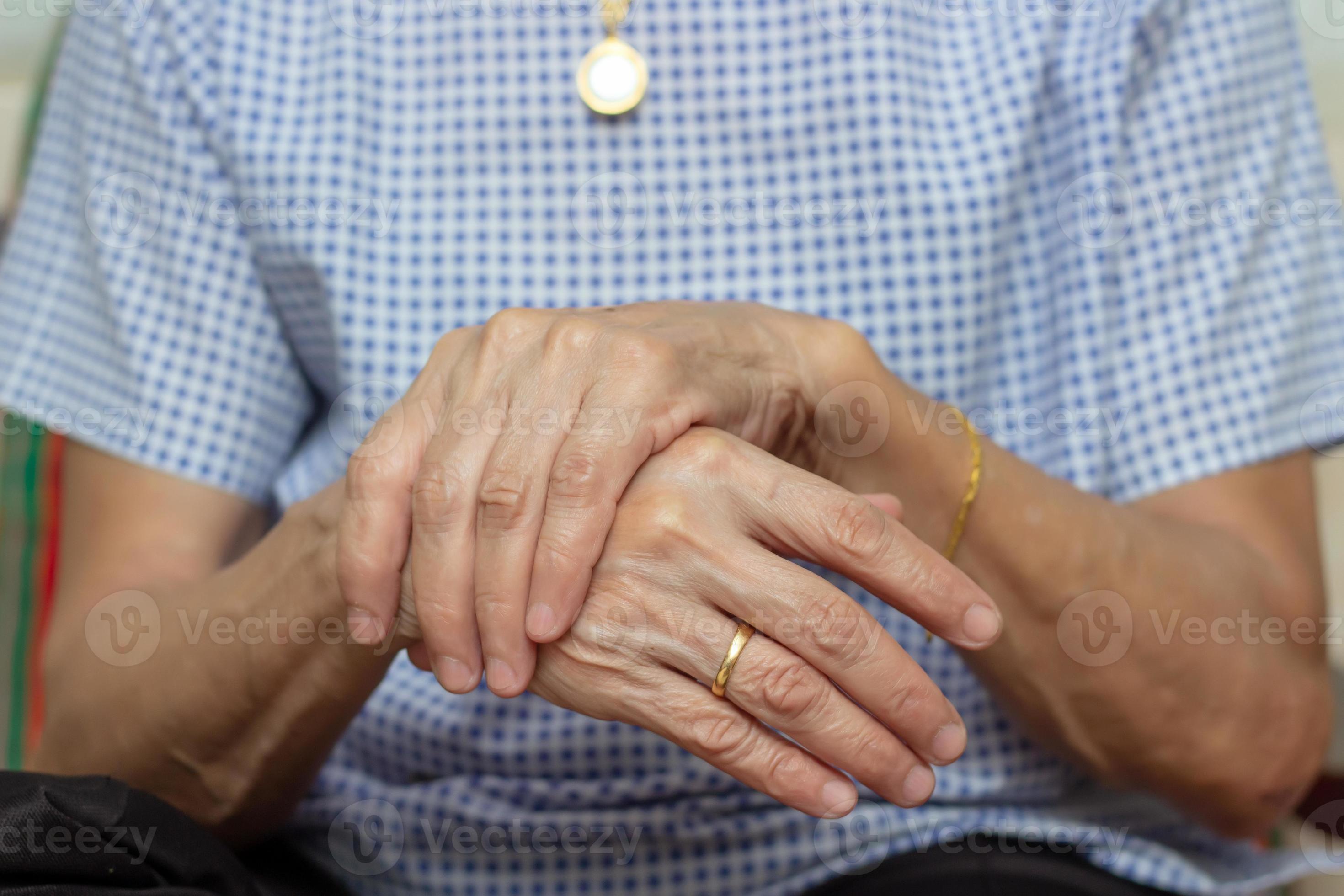 Holding hand adult woman with pain in muscles and joints,Symptoms of