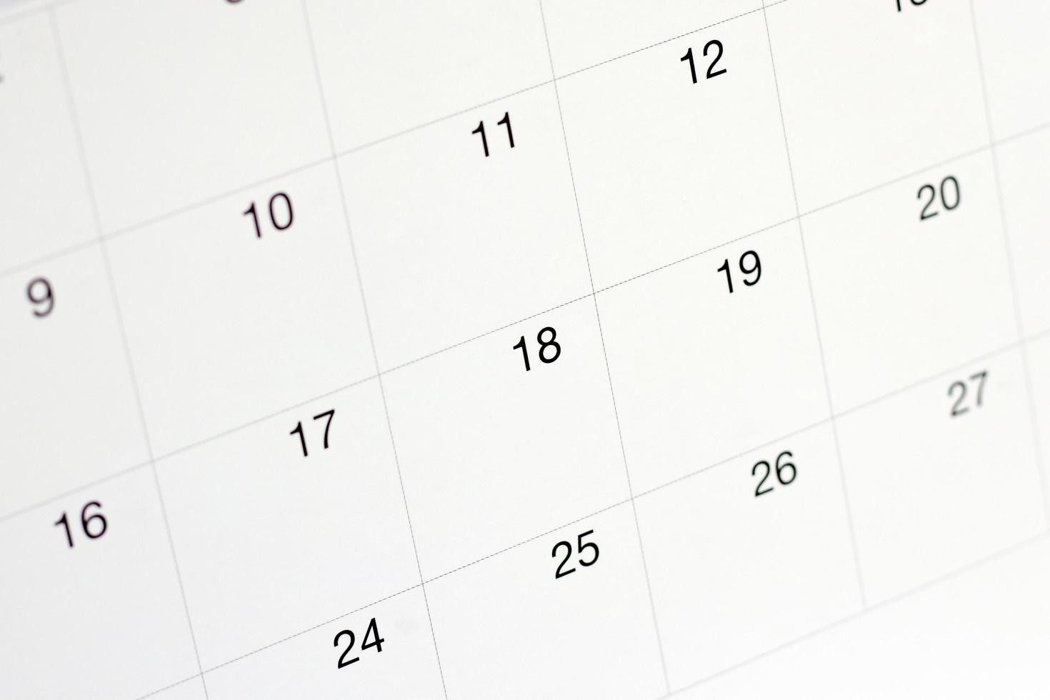 fechas en el fondo de la página del calendario, primer plano de los números en la página del calendario foto