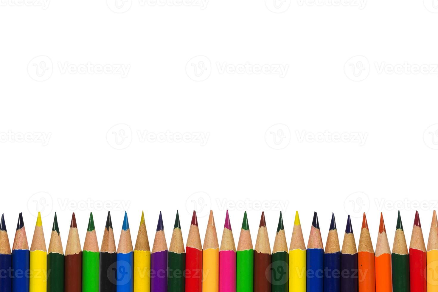 Many multicolored pencils lined up in a row isolated on white background with copy space, Art and education background photo