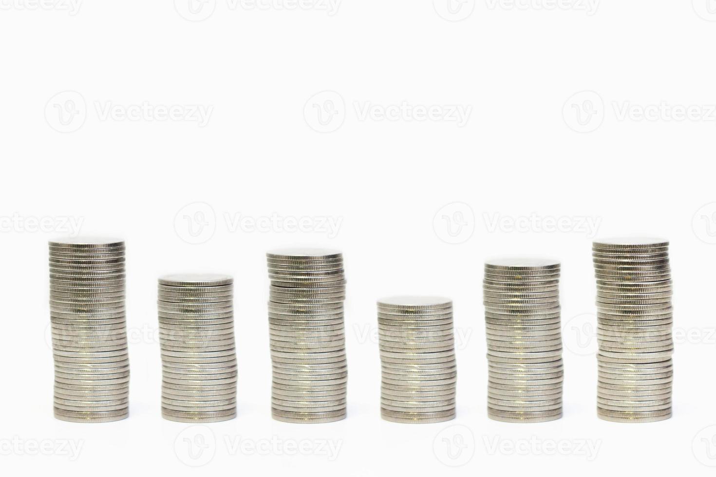 Silver coins stack arranged as graph on isolated white background, Money growing concept and sustainable investment, Business success and financial concept,  Banking and saving and economy idea photo