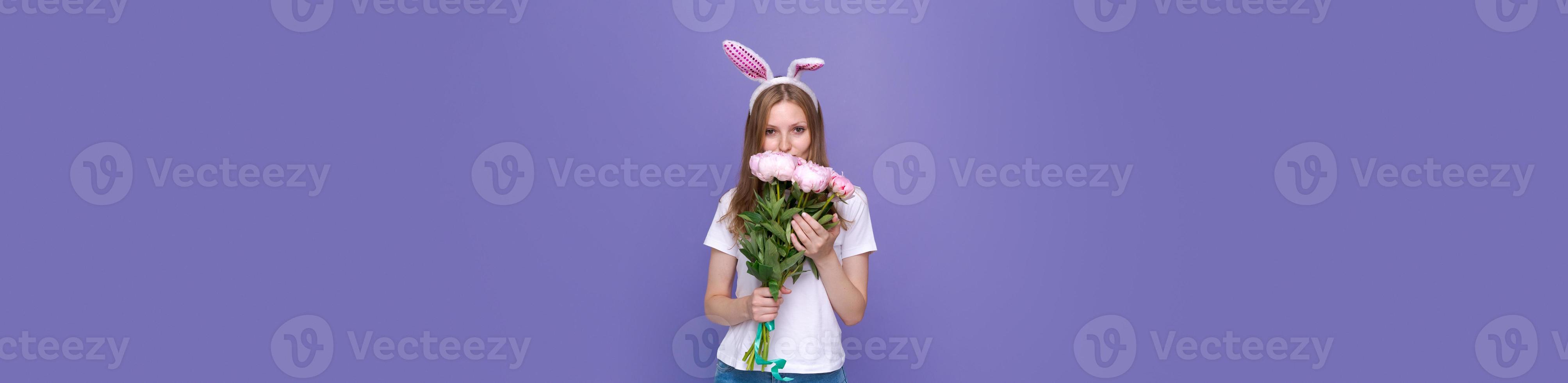 Easter holidays, spring concept - happy funny, crazy young girl in headband photo