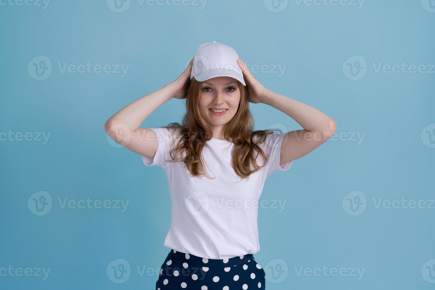 Young caucasian girl in delivery uniform and white cap looks confident photo