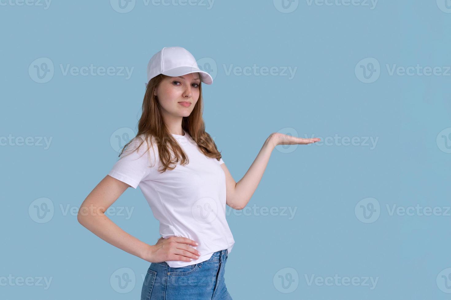 Young happy surprised smiling female promoter 20s in white photo