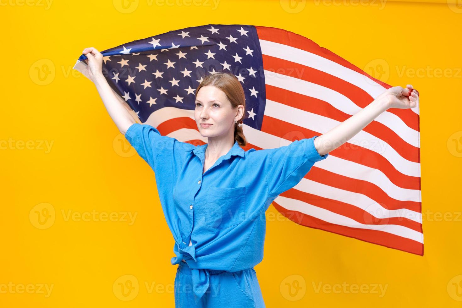 Celebration Independence Day. Stars and stripes. Young woman holding United photo