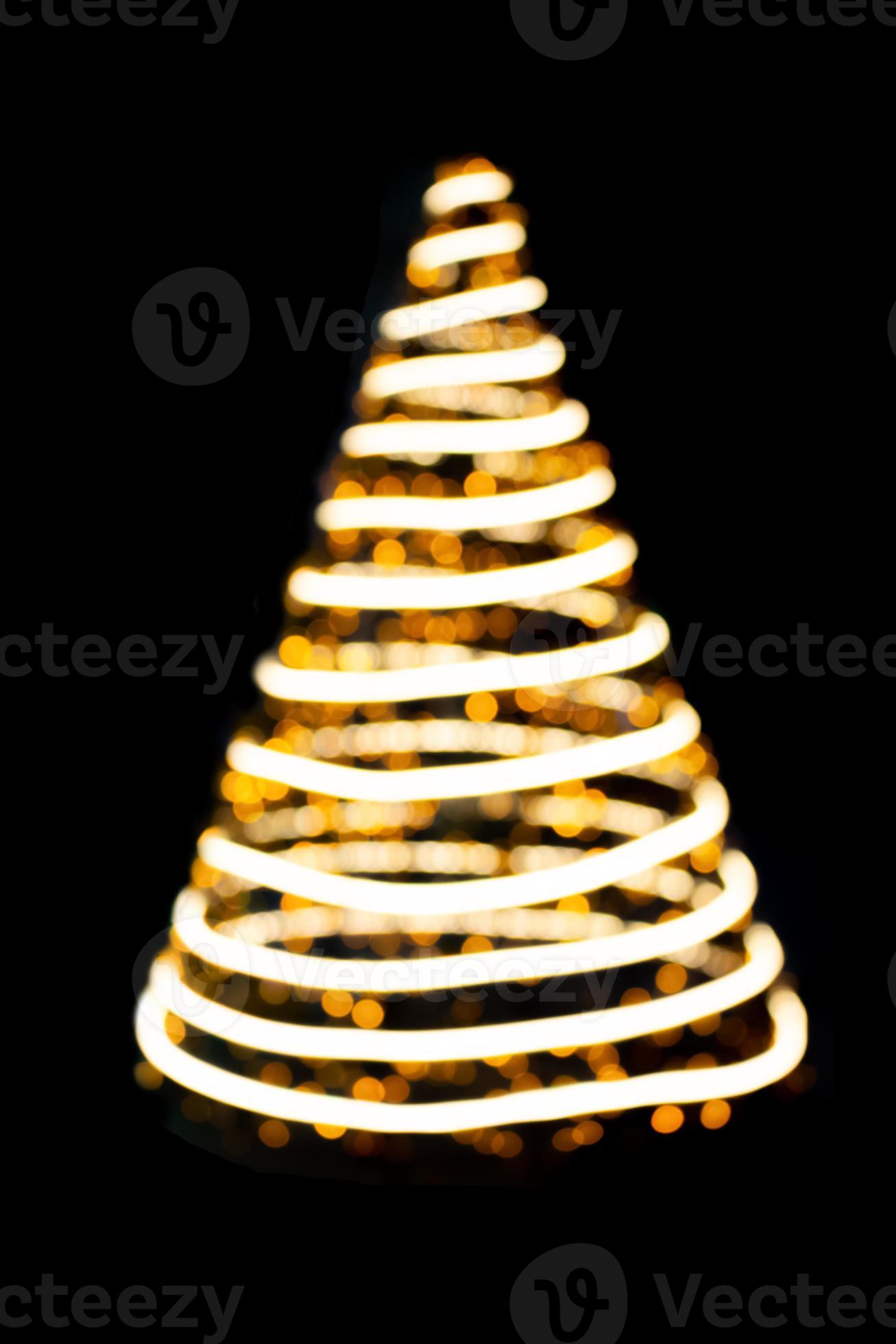 Defocused lights spiral Christmas tree on black isolated background