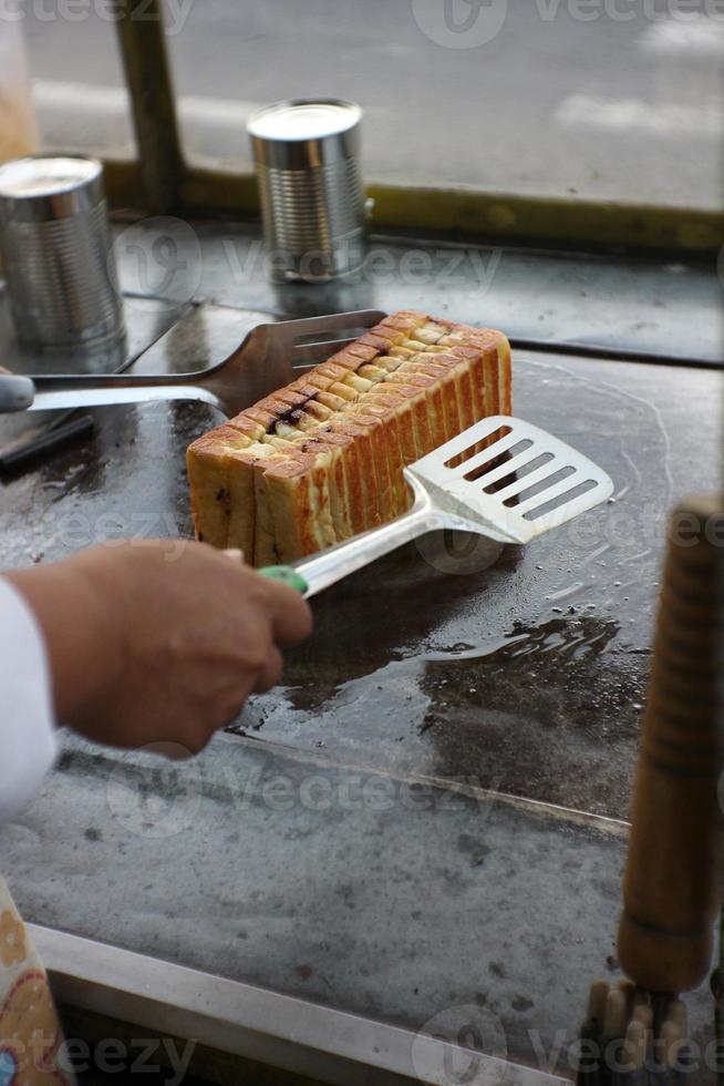 process of baking toast for sale. photo