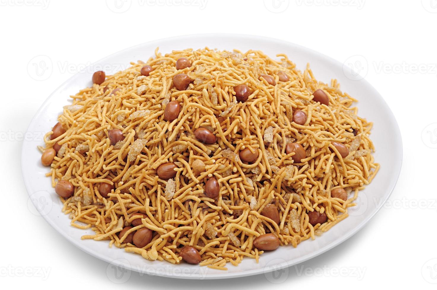 Bombay mix chanachur and nut on white ceramic plate front view photo