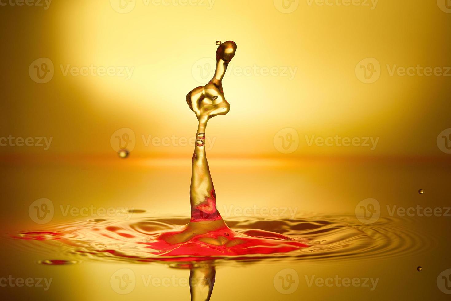 splash of water on a yellow background photo