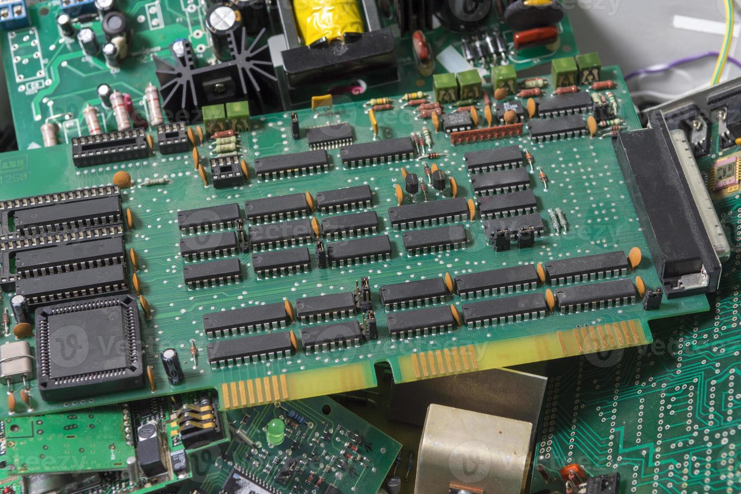 selective focus of Electronic waste of PCB circuit board. Recycling of electronic waste. photo