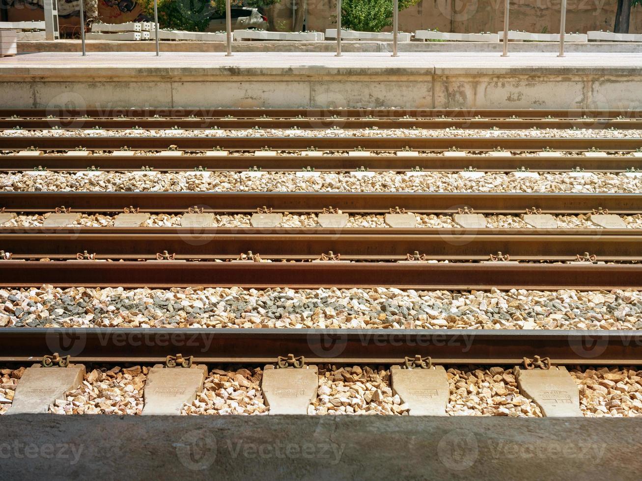 Railway tracks between the two platforms of the railway station photo