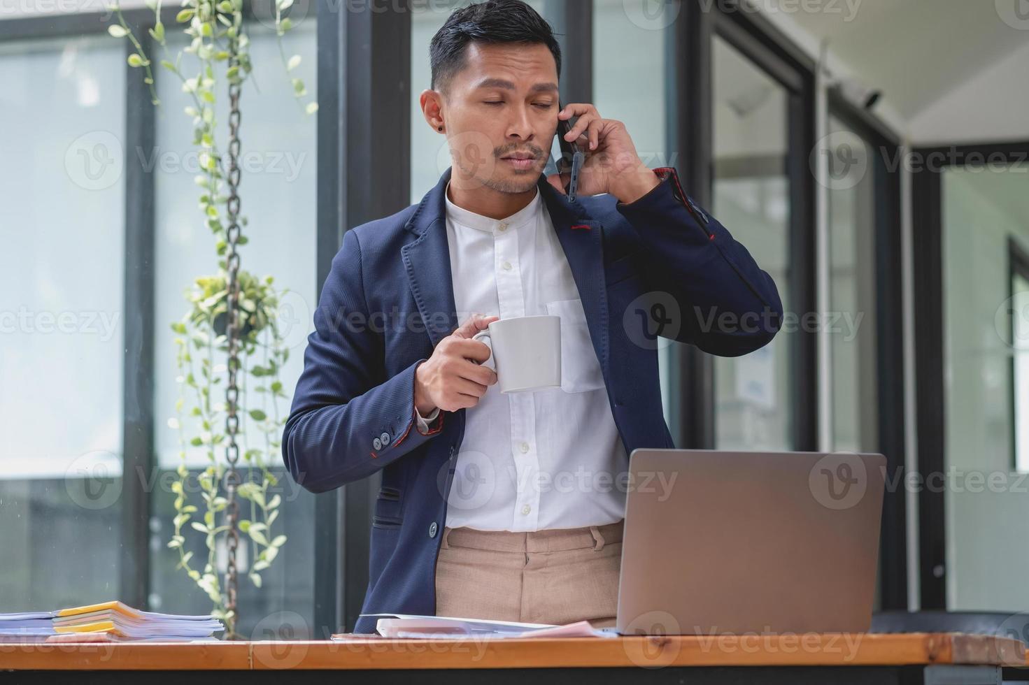 Marketing, Financial, Accounting, Planning, businessman uses a mobile phone to contact a customer to inform her of the company is business partnership. photo