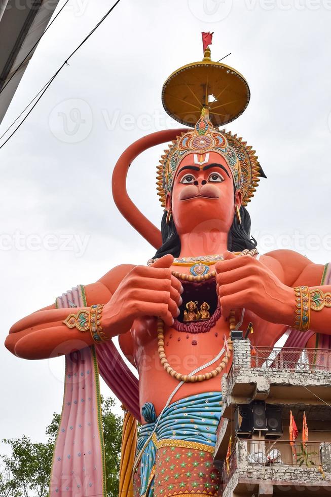 Big statue of Lord Hanuman near the delhi metro bridge situated near Karol Bagh, Delhi, India, Lord Hanuman big statue touching sky photo