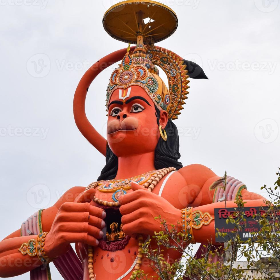 Big statue of Lord Hanuman near the delhi metro bridge situated near Karol Bagh, Delhi, India, Lord Hanuman big statue touching sky photo