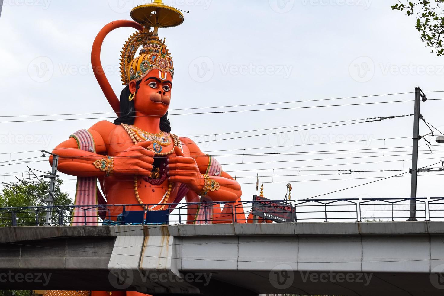 Big statue of Lord Hanuman near the delhi metro bridge situated near Karol Bagh, Delhi, India, Lord Hanuman big statue touching sky photo