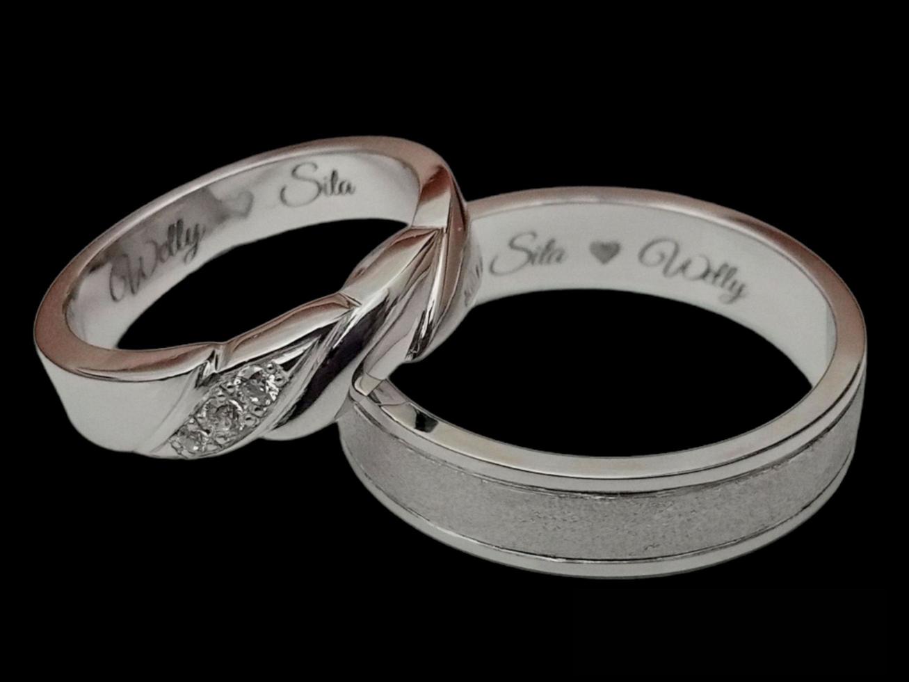 Wedding rings. Silver ring with black background isolated photo