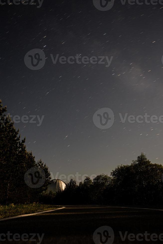 Night starry sky in mountains photo