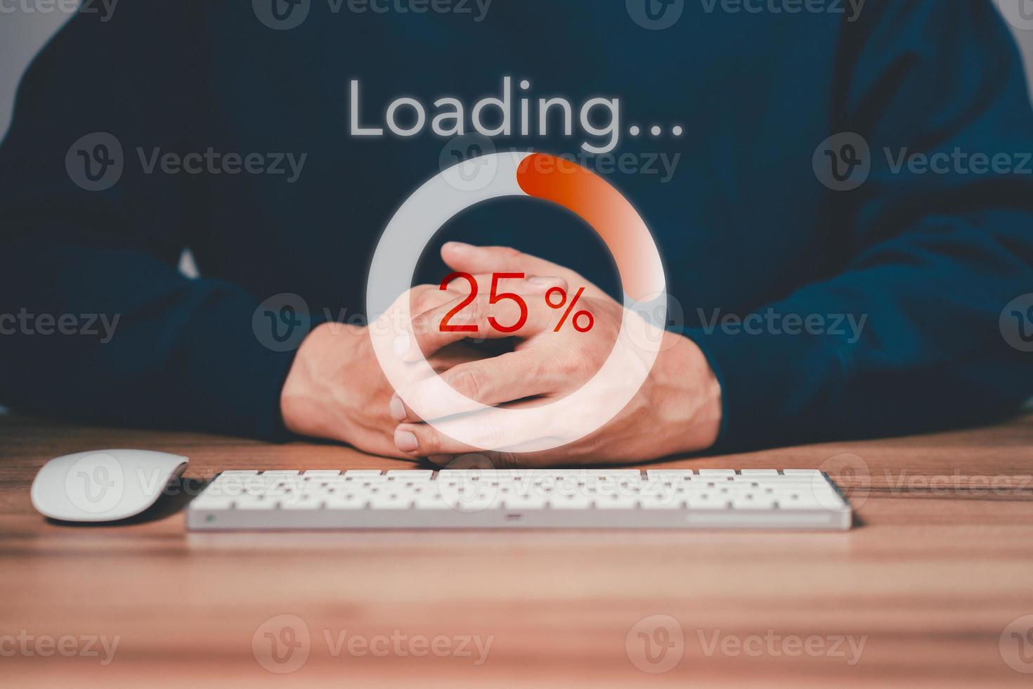 Man using a computer keyboard to download and waiting to loading digital business data form website, concept of waiting for load of loading bar. photo