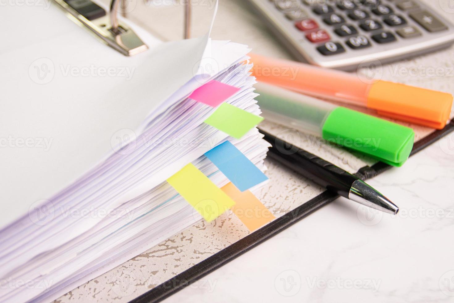 document color graph sheet for presentation on room table at the office with equipment calculator, pencil, color pen highlight photo