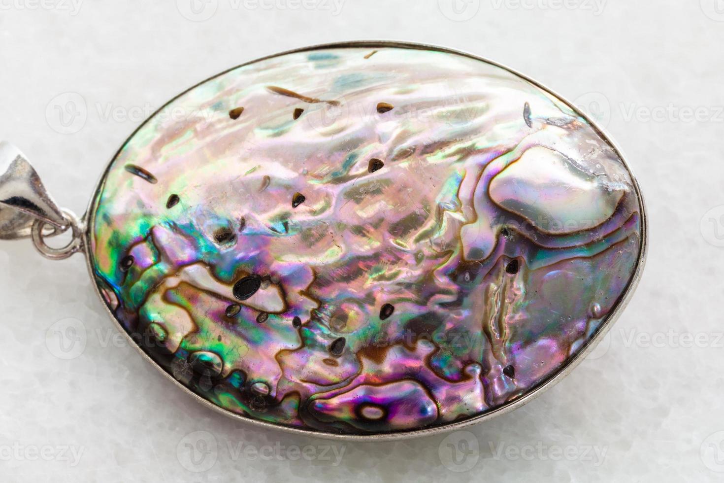 pendant from Abalone haliotis shell on white photo