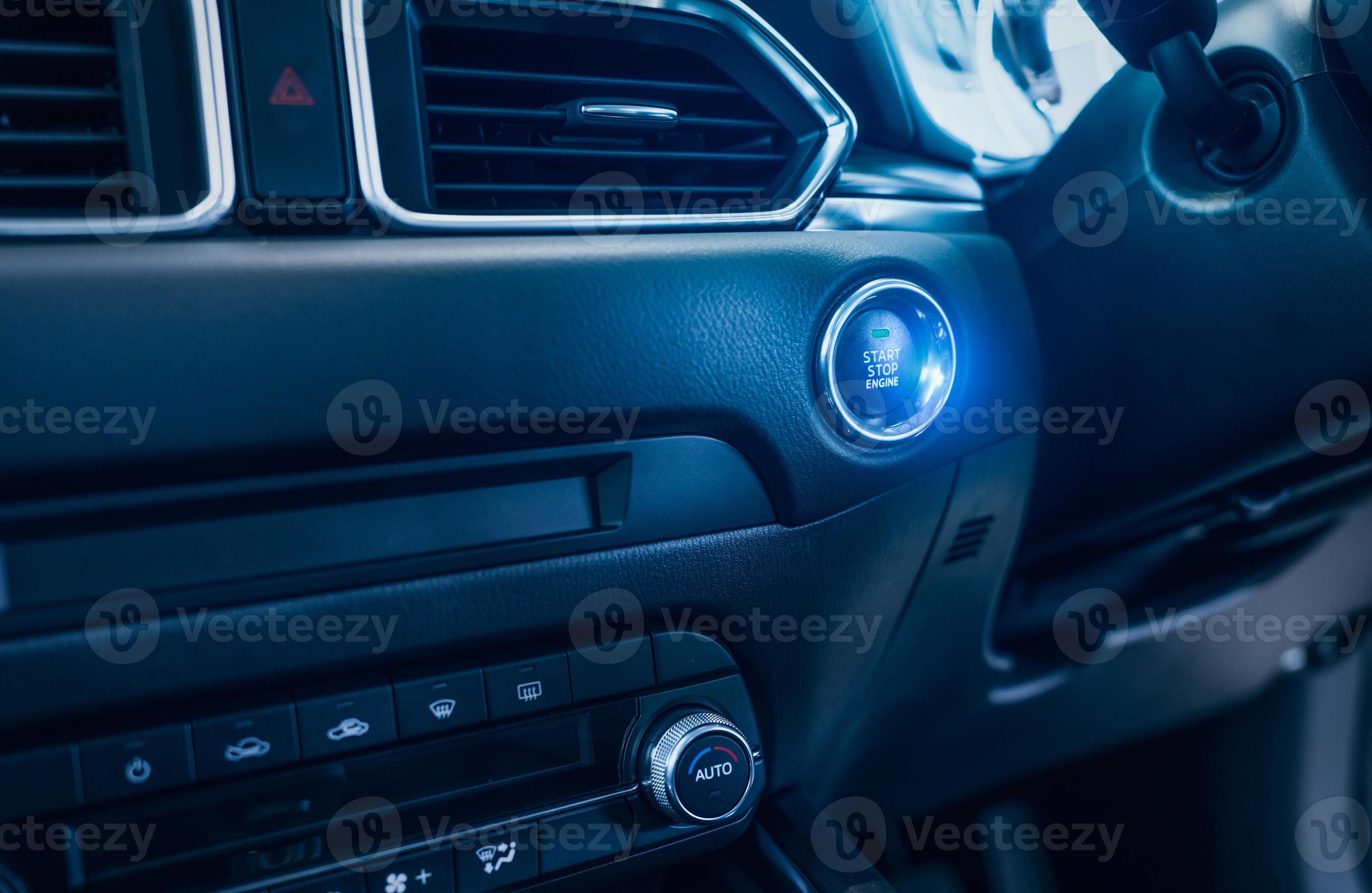Start stop engine button of luxury car. Push up button for start or