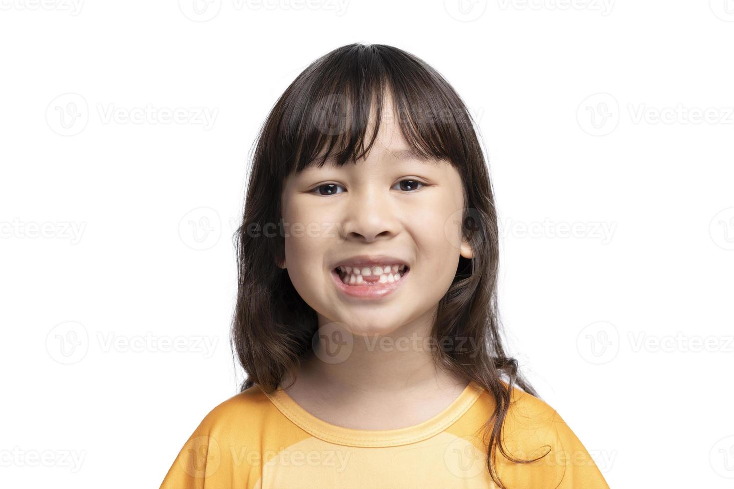 Cute girl opens her mouth to show her missing teeth. Tooth loss by age concept, replacement of permanent teeth. Tooth removal. photo