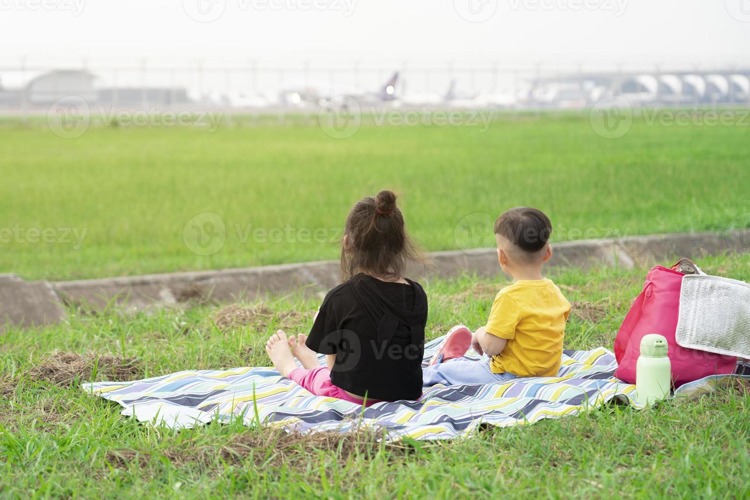 The children enjoyed watching the planes take off and land at the airport on weekends with their families. photo