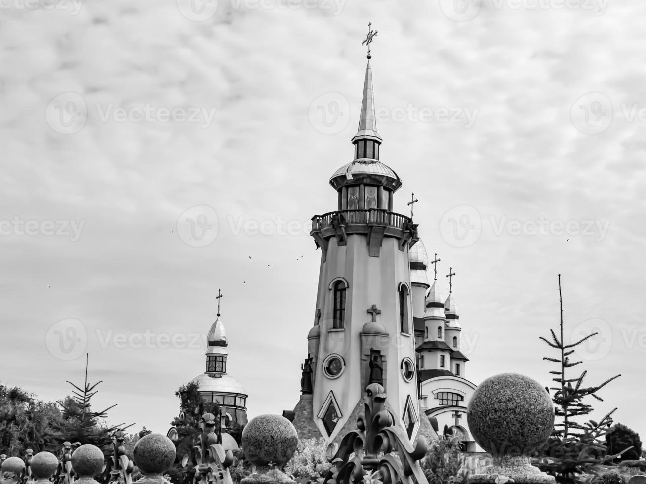 Christian church cross in high steeple tower for prayer photo