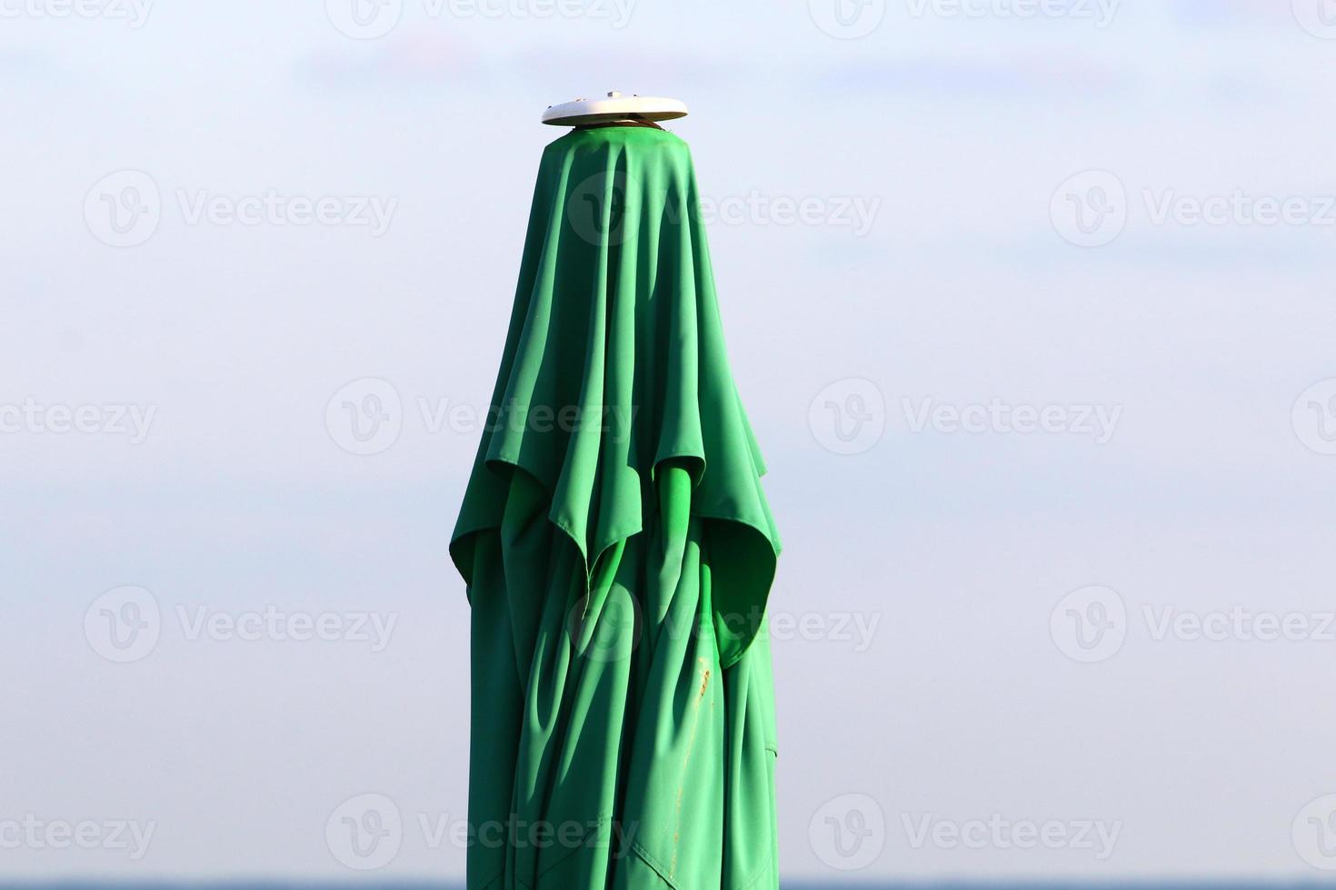 Umbrella in the city park near the sea. photo