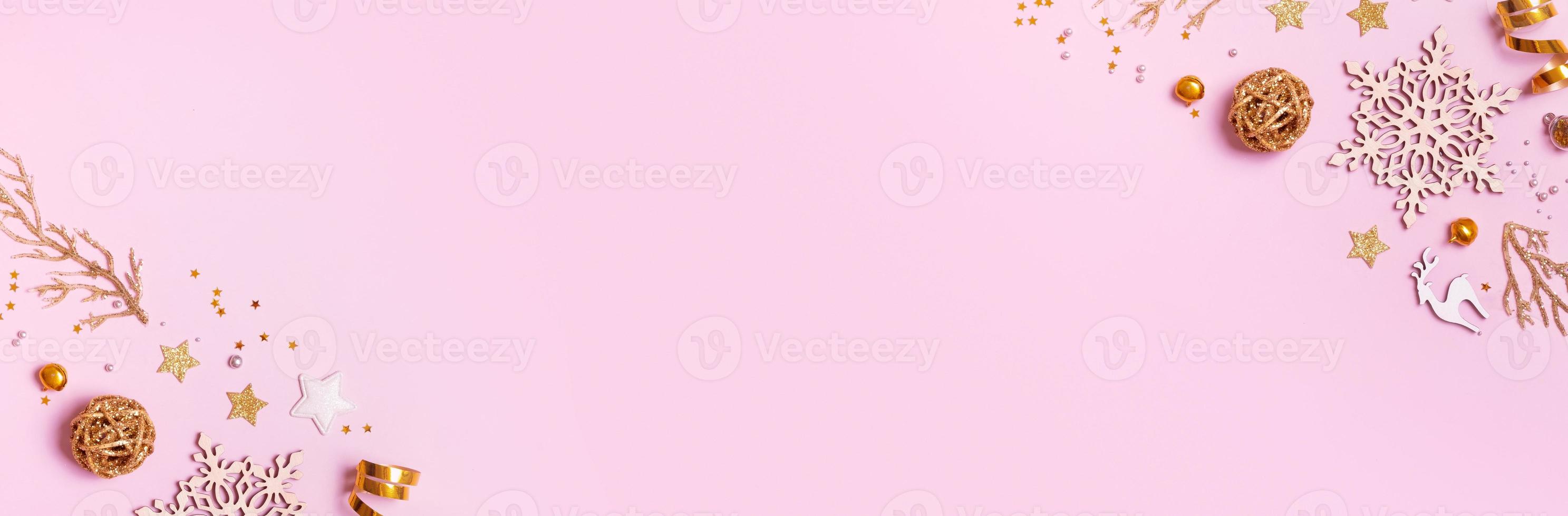 Christmas banner with minimalistic composition on pink background with golden decor and copy space photo