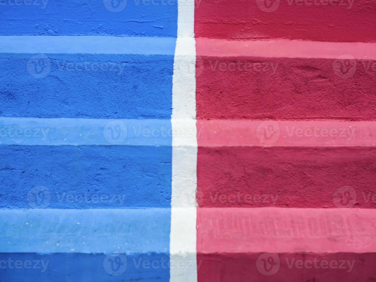 Close-up of blue and red concrete step wth white middle line photo