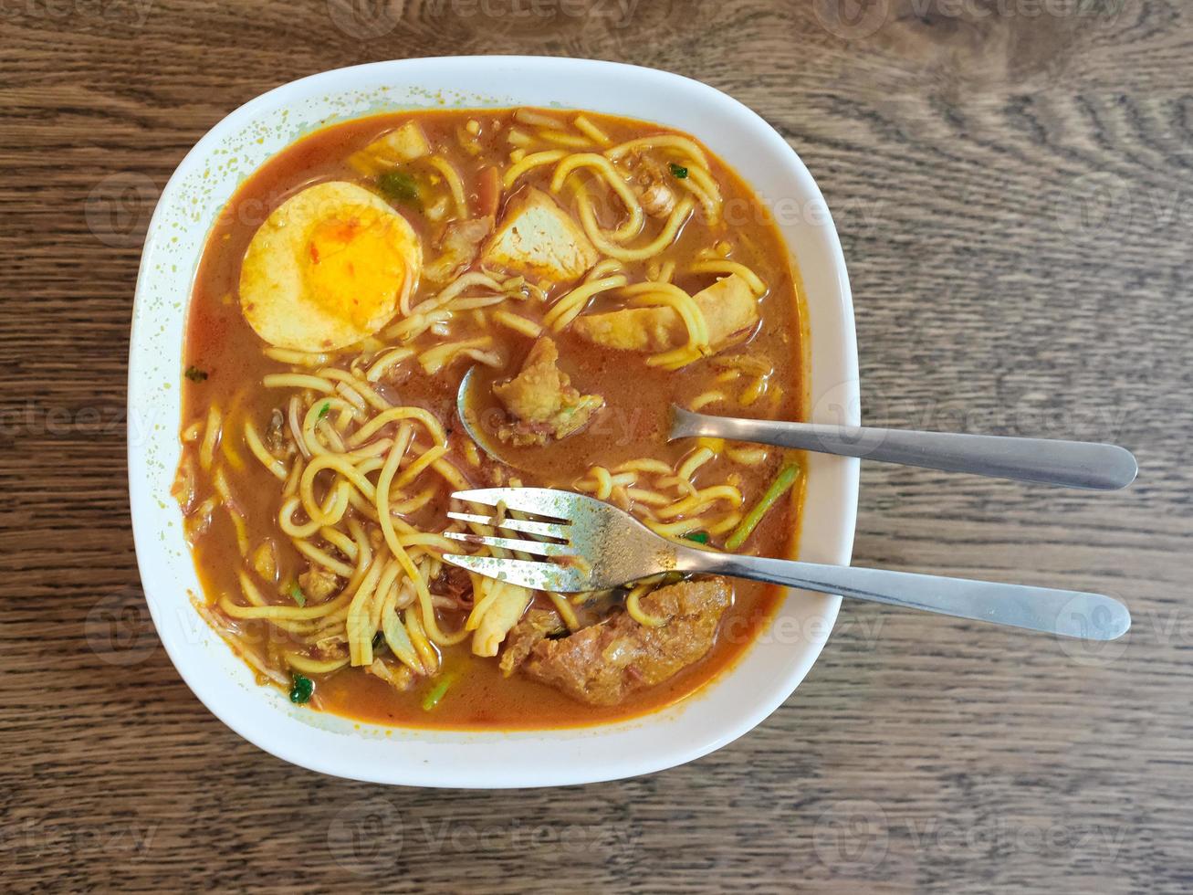 Close-up view of a spicy curry noodles photo