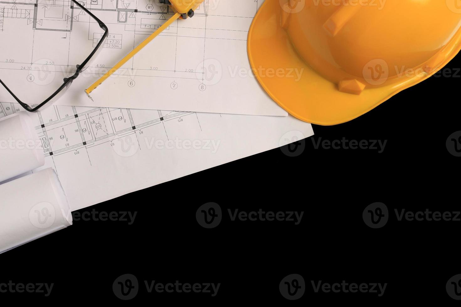 Top view, architect's office desk with construction drawings. photo