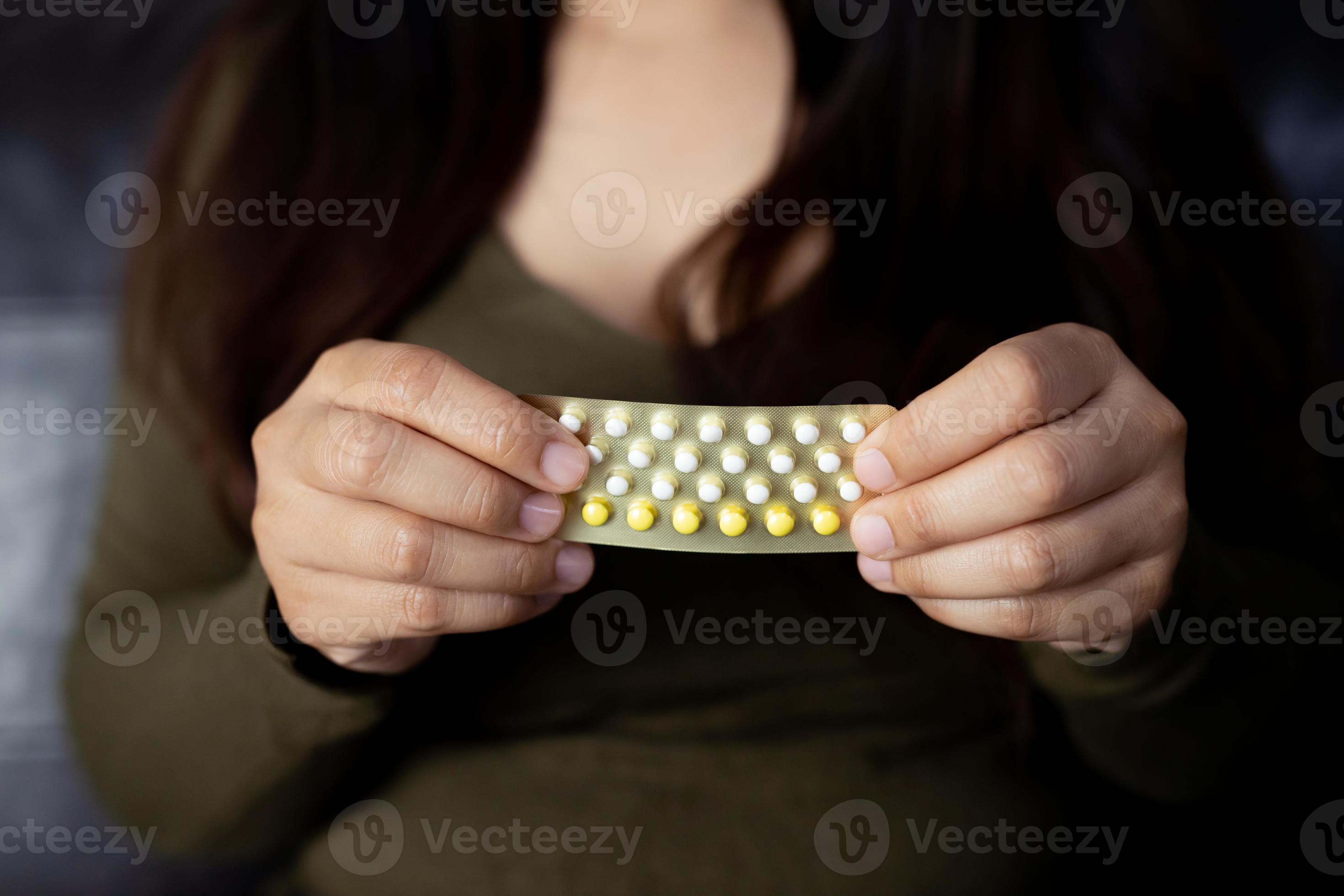 Women carry birth control pills, focus Hand 13133597 Stock Photo at