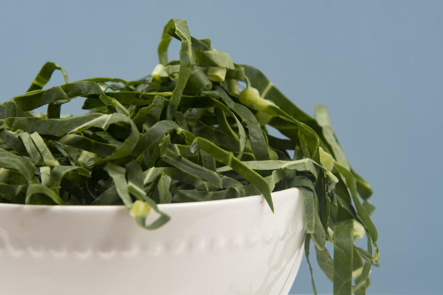 cabbage chopped into strips in pot isolated, photo
