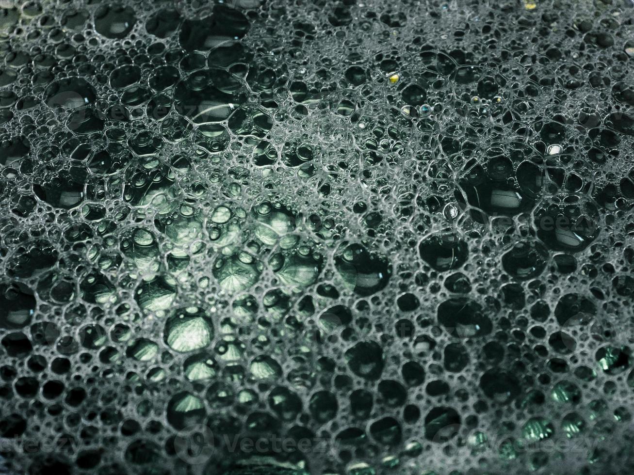 Close-up view of washing liquid bubbles photo