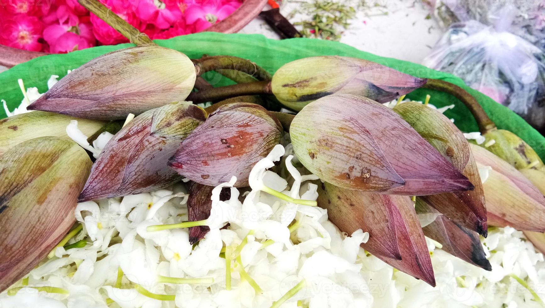 lotus flower bud with white flowers in a basket photo