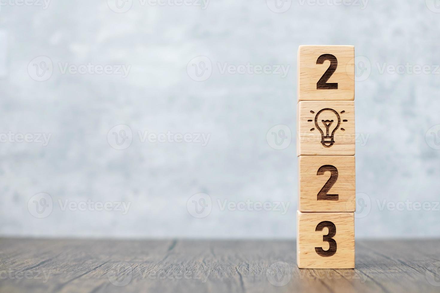 2023 block with lightbulb icon. Business Idea, Creative, Thinking, brainstorm, Goal, Resolution, strategy, plan, Action, change and New Year start concepts photo