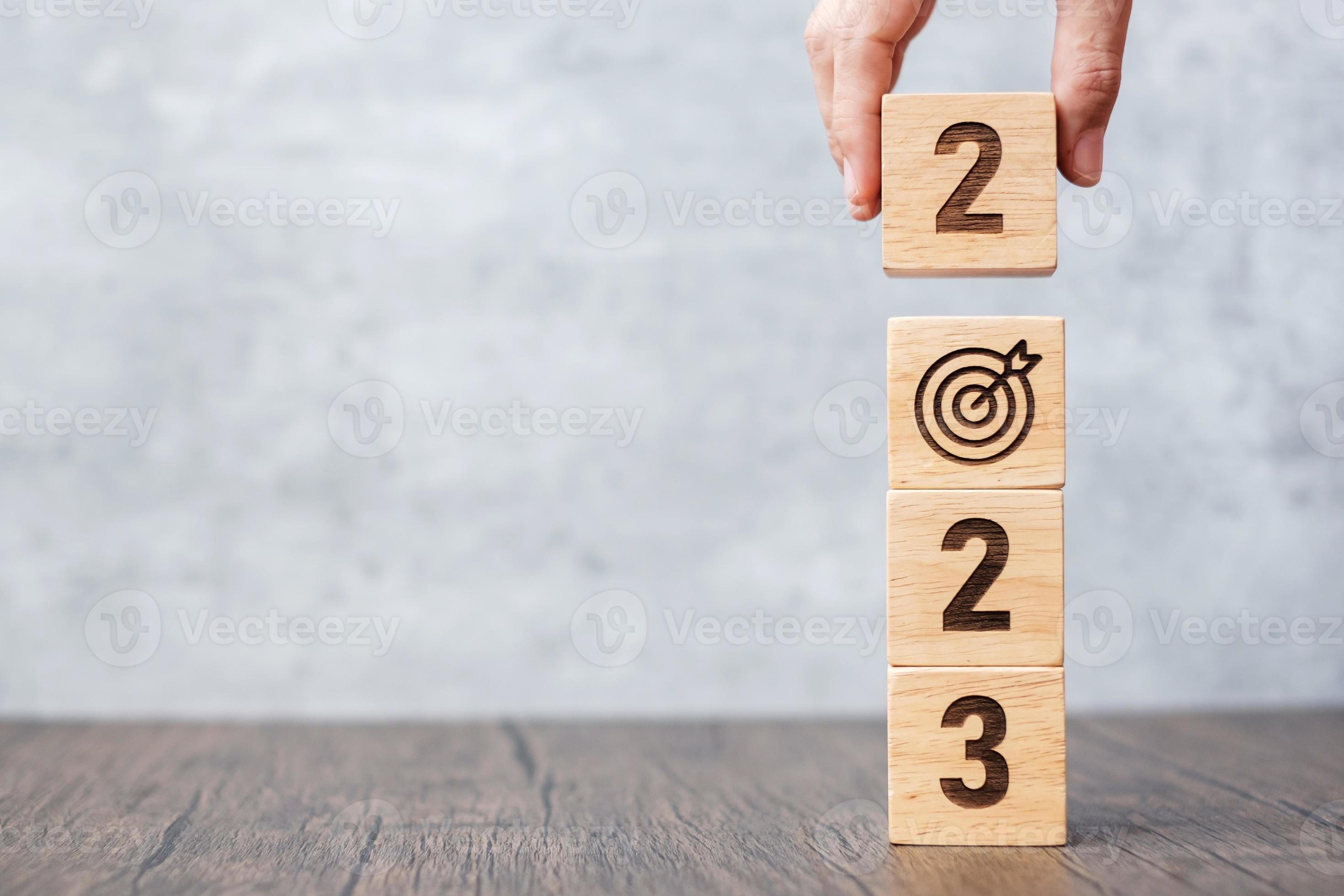 2023 block with dartboard sign. Business Goal, Target, Resolution