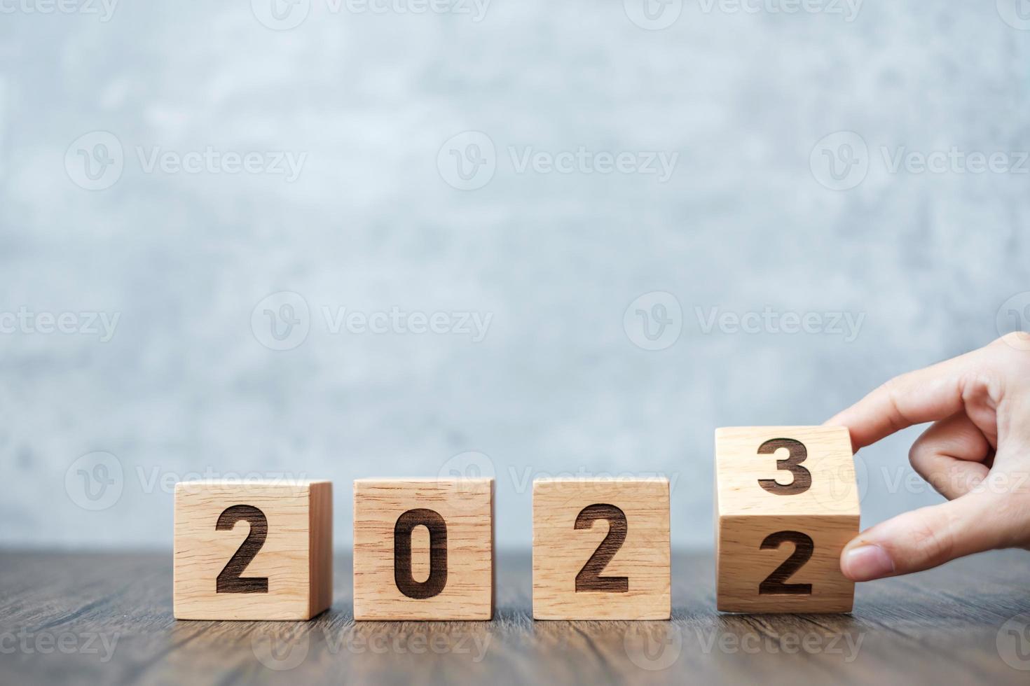 hand flip 2022 to 2023 block. goal, Resolution, strategy, plan,, motivation, reboot, forecast, change, countdown and New Year holiday concepts photo