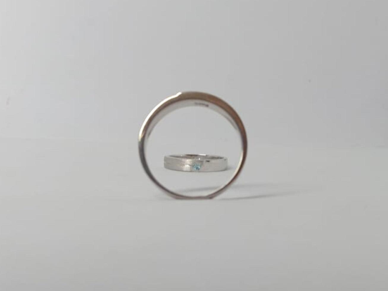 Wedding rings. Couple of silver and white gold with white background isolated photo