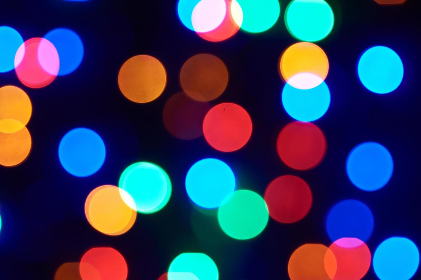 abstract blurred and glittering shine bulbs lights background. blur of Christmas wallpaper decorations concept photo