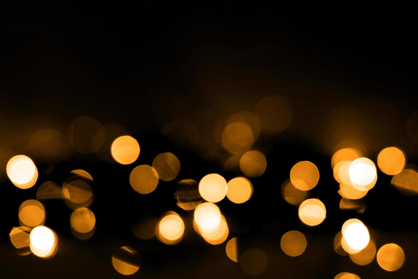 abstract blurred and silver glittering shine bulbs lights background. blur of Christmas wallpaper decorations concept photo
