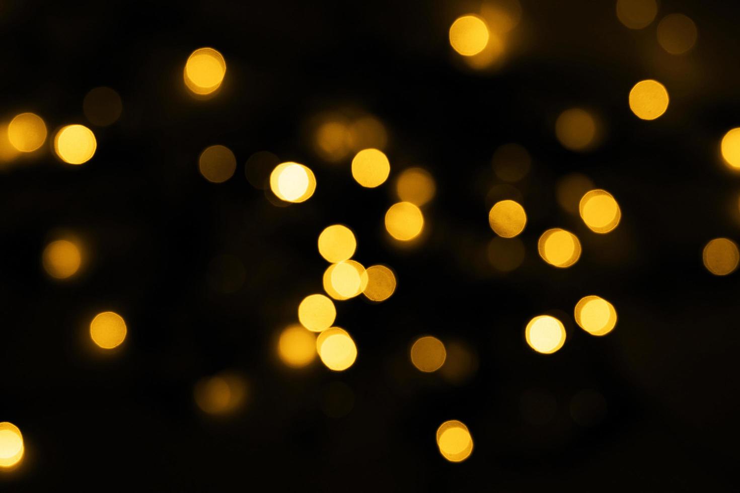 abstract blurred and silver glittering shine bulbs lights background. blur of Christmas wallpaper decorations concept photo