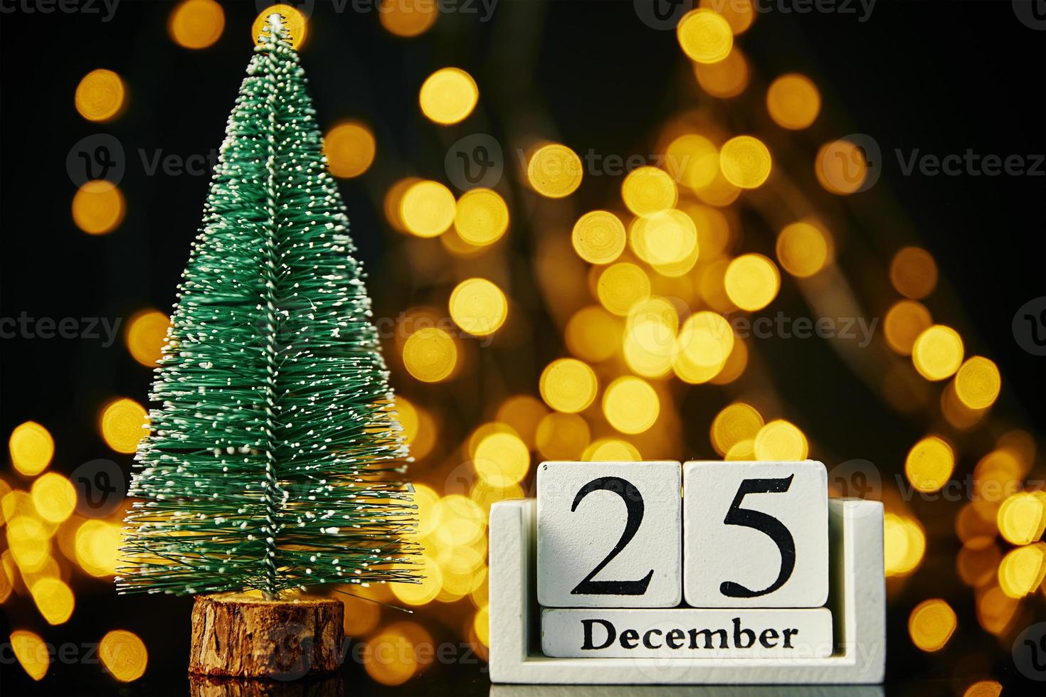 Merry Christmas and Happy New Year composition with christmas tree on dark background photo