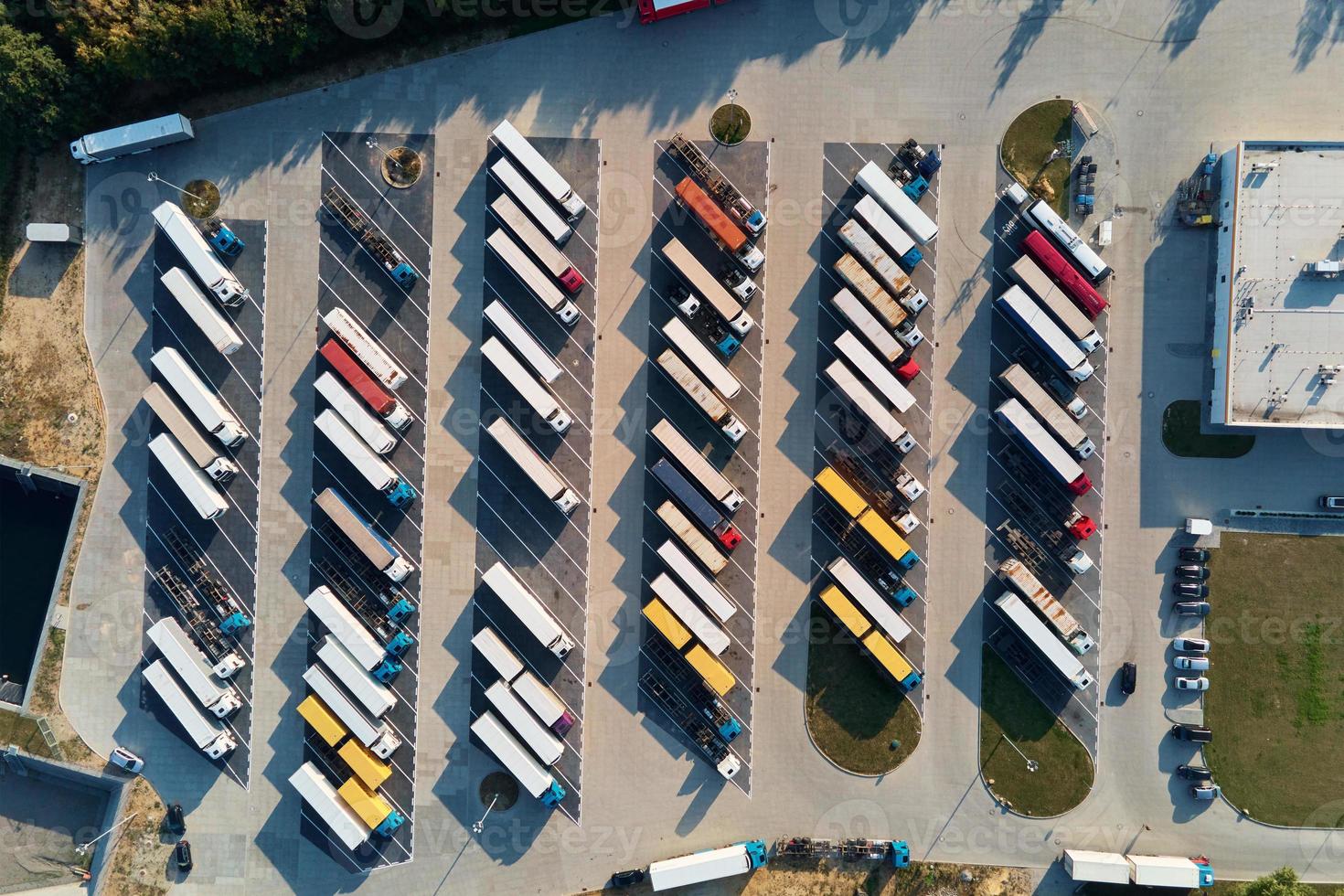 Top view parking lot with parked trucks photo